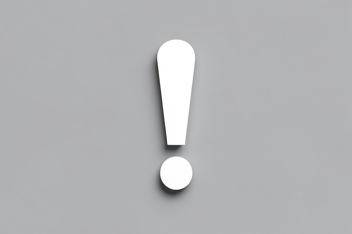 A warning sign in the shape of an exclamation mark on a neutral background.